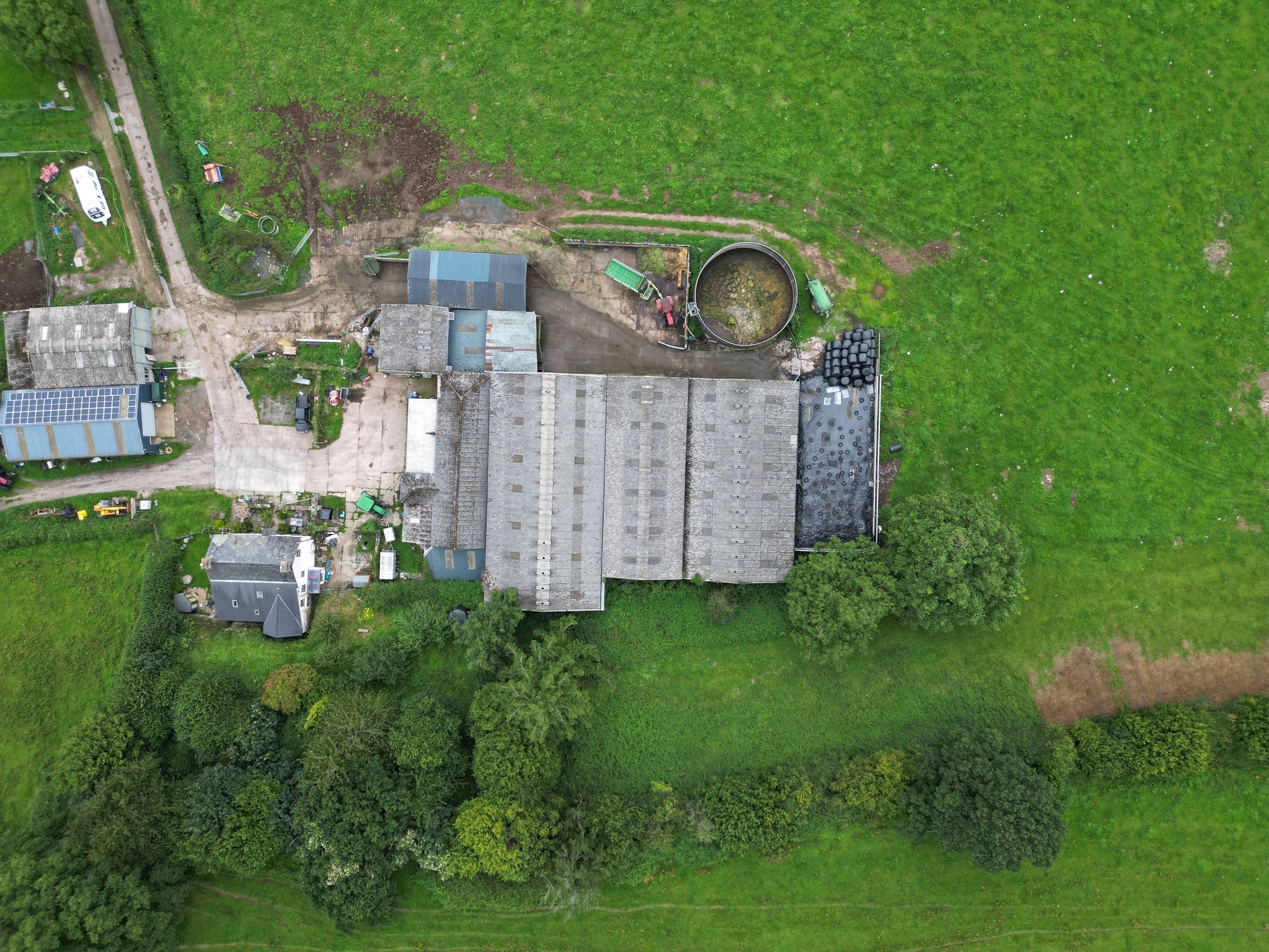 Aerial view of a working farm with barns and fields
