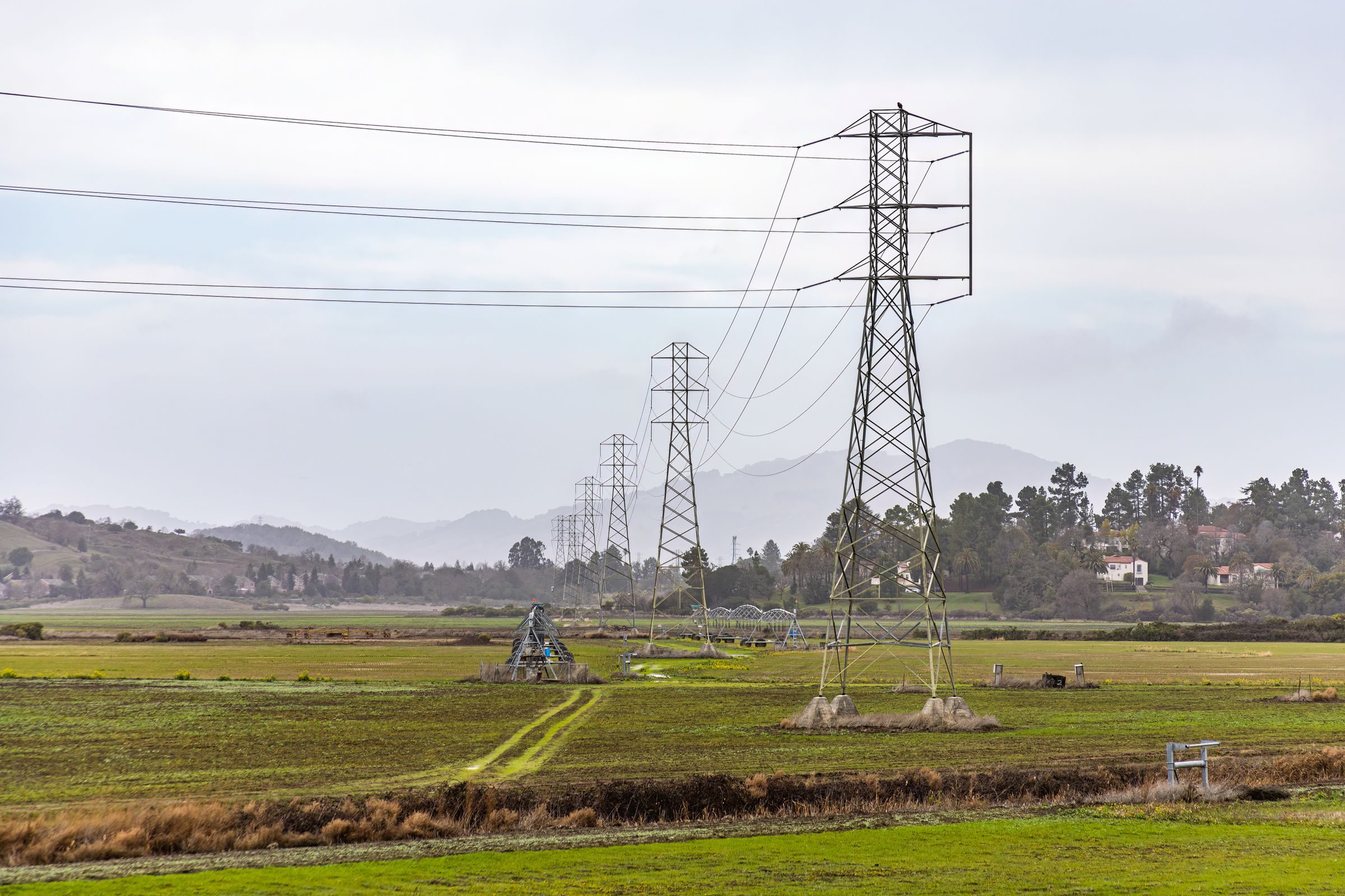 Overhead power lines crossing farmland