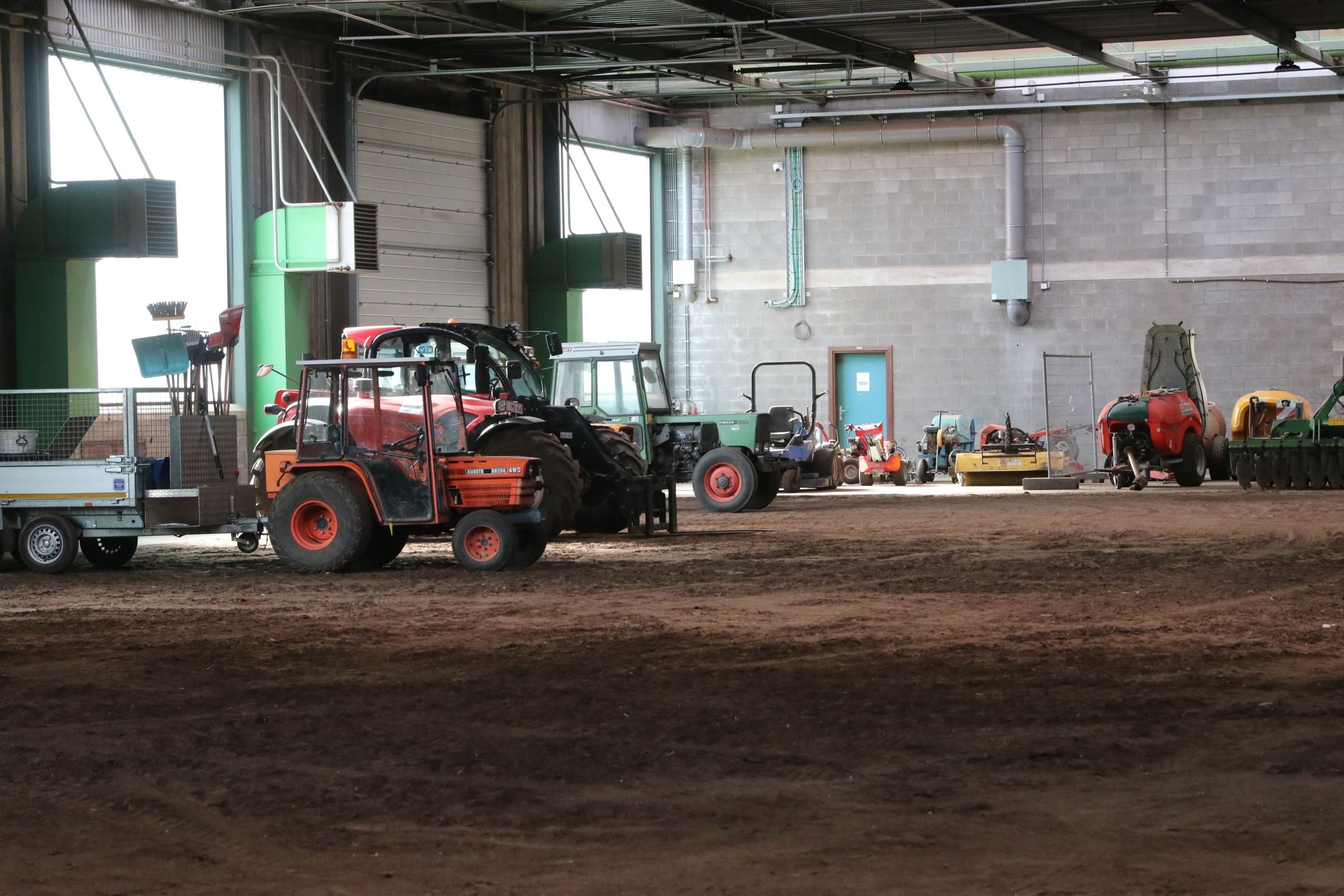Tractors and machinery in a farm workshop