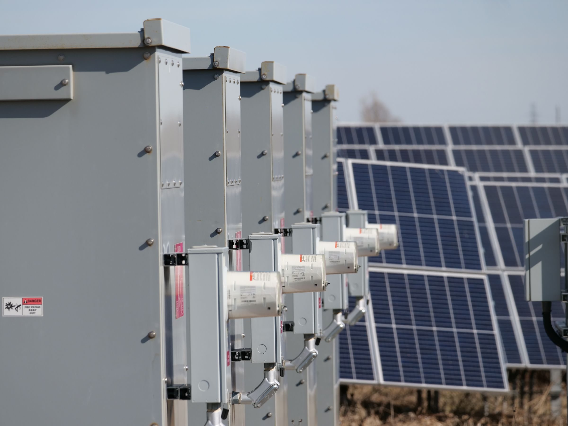 Export metering and isolation equipment beside a solar array